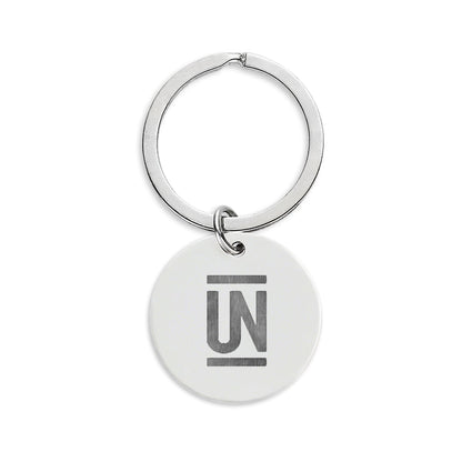 Engraved Stainless Steel Round Keychain — Uncommon Schools Logo