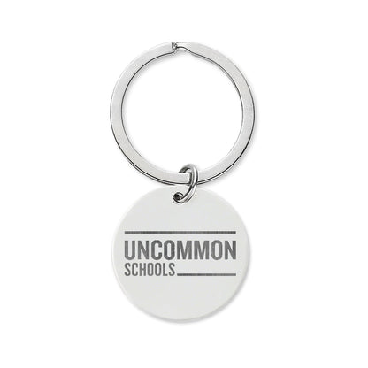 Engraved Stainless Steel Round Keychain — Uncommon Schools Logo