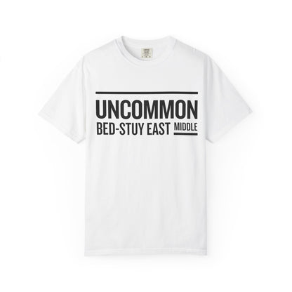 White t-shirt with black text on a white background